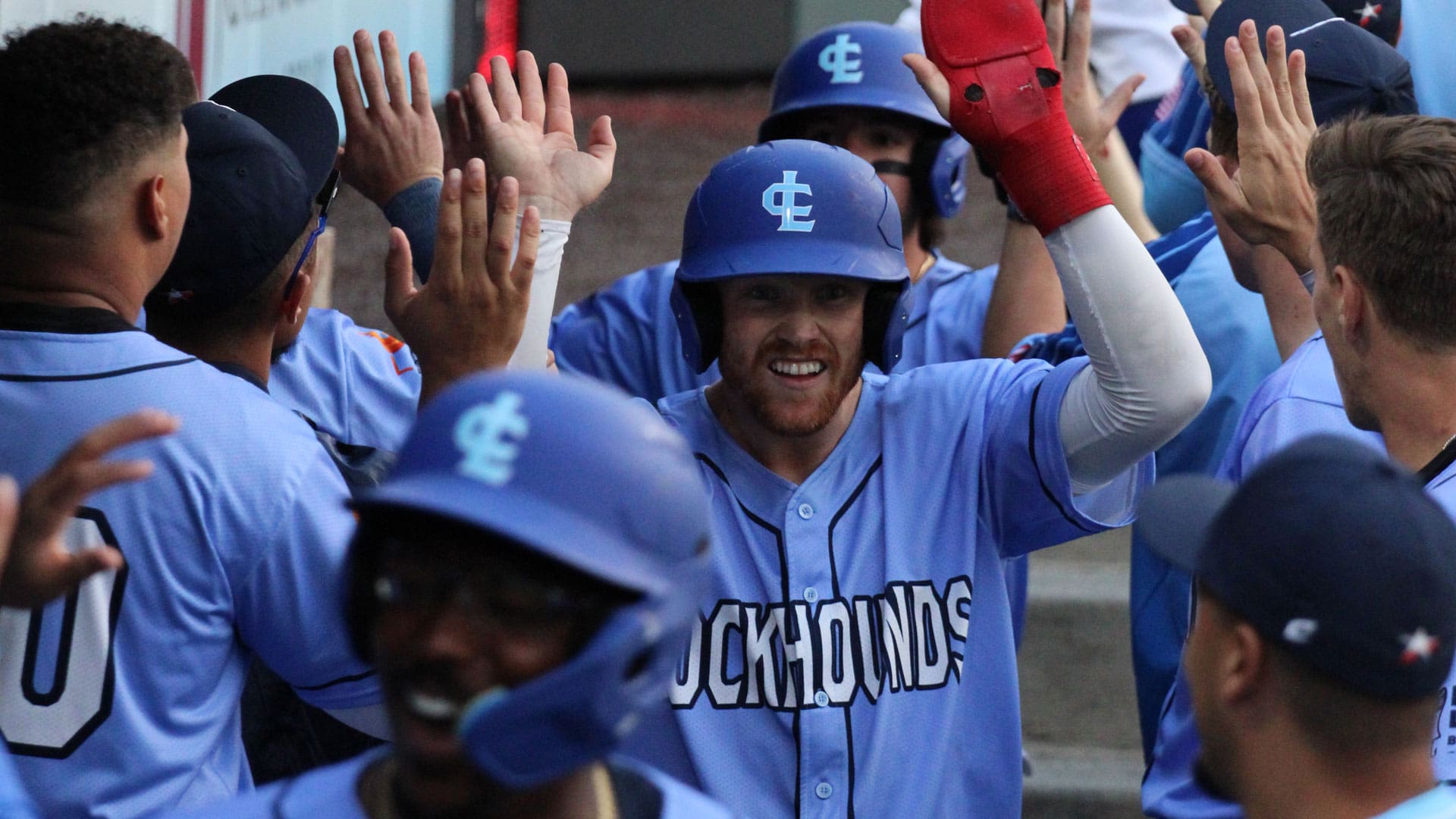 Justin Connell celebrates with his teammates during an 11-2 victory over Cleburne