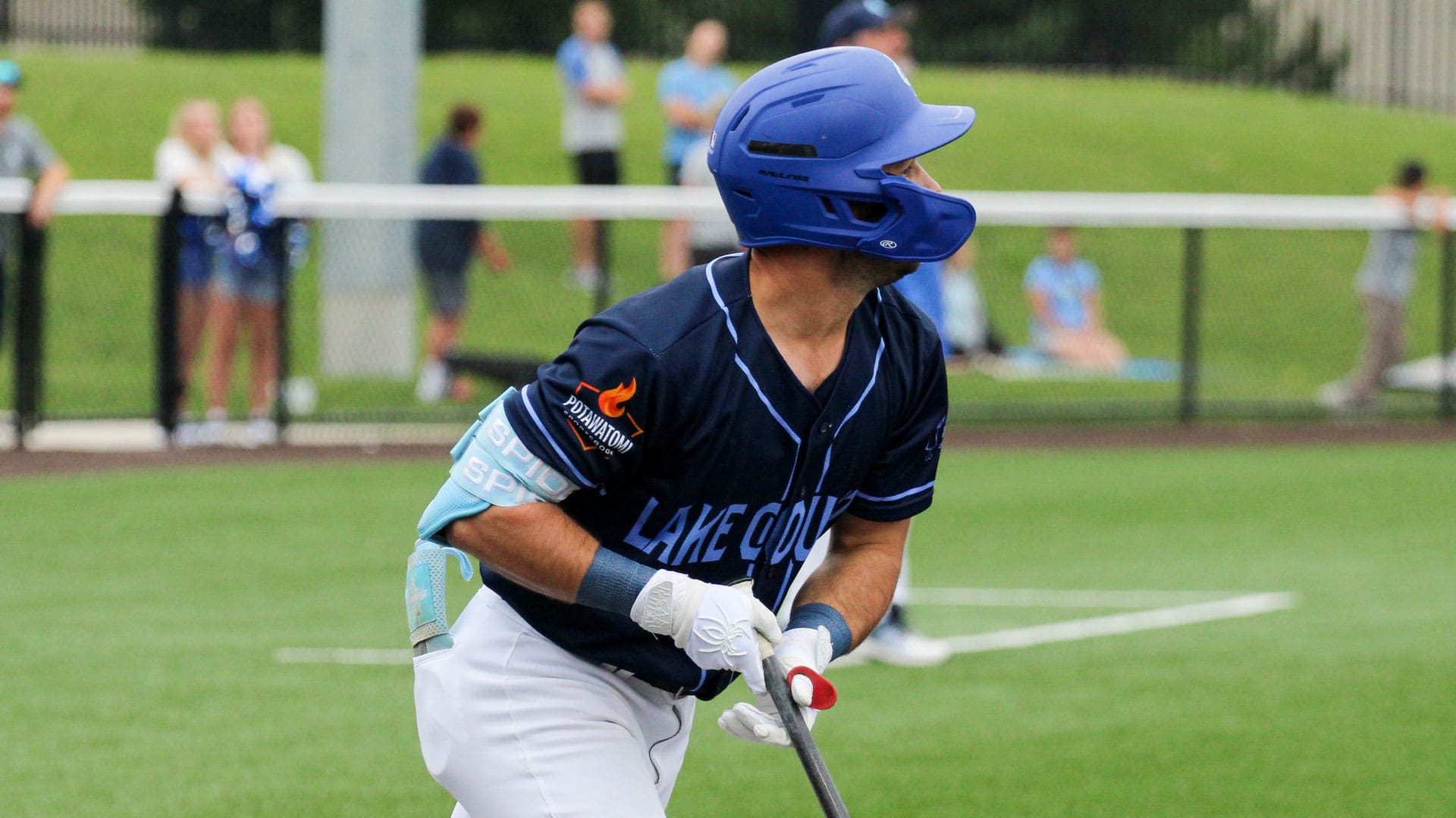 Ray Zuberer III watches a ball sail to centerfield