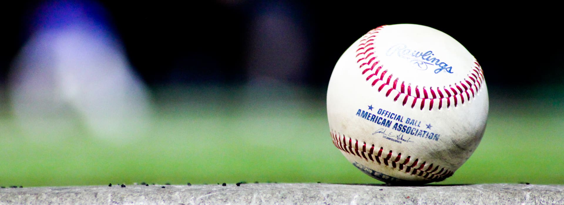 American Association baseball sitting on first base