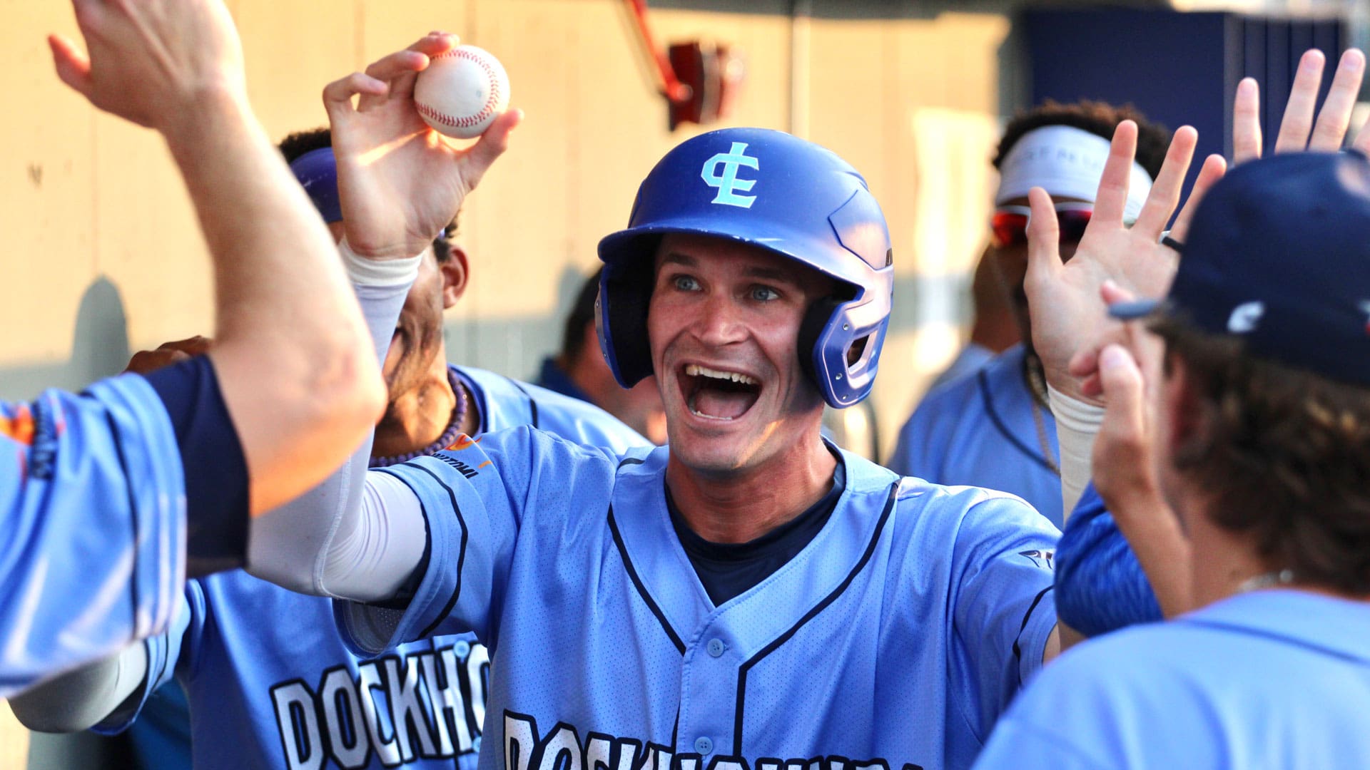 Josh Altmann celebrates with baseball in hand