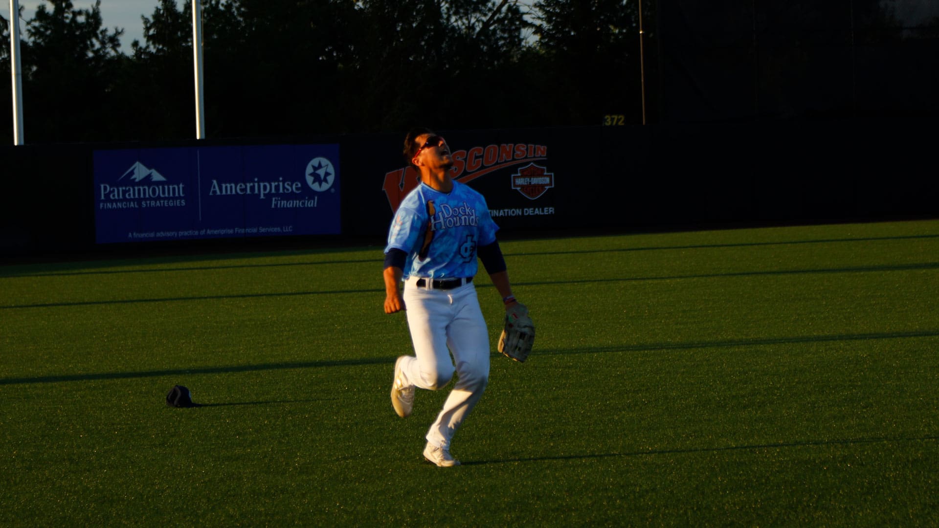 Samuel Benjamin tracking a fly ball while playing in left field