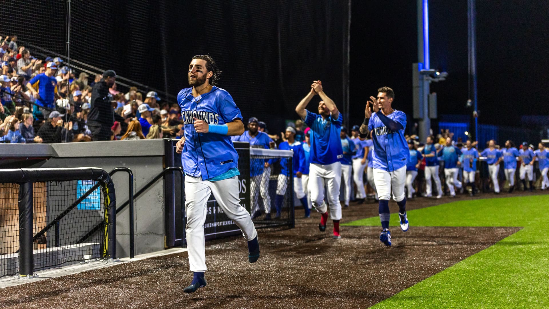 Blake Tiberi and Marek Chlup celebrate with the fans after the DockHounds clinch the teams first playoff berth